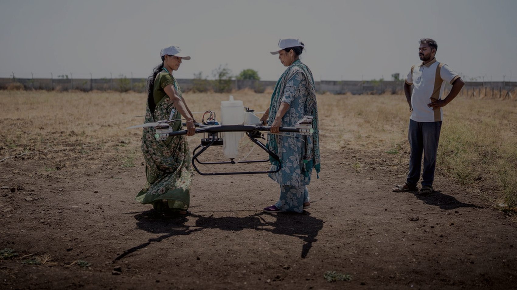 UAV flying survey lines over a mapped field